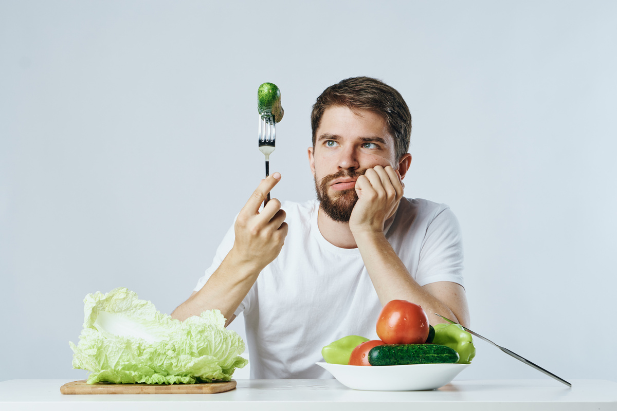 Man in a White T-Shirt Vegetables Diet and Vegetarian Lifestyle